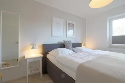 Ein Bett oder Betten in einem Zimmer der Unterkunft Lilli Marleen WE 04