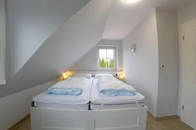 Ein Bett oder Betten in einem Zimmer der Unterkunft KI8a Ferienhaus Ruby