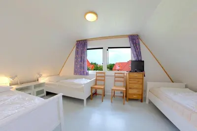 Ein Bett oder Betten in einem Zimmer der Unterkunft SL Tegeler Plate 8