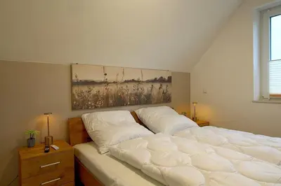 Ein Bett oder Betten in einem Zimmer der Unterkunft AE13 Engelsbrise