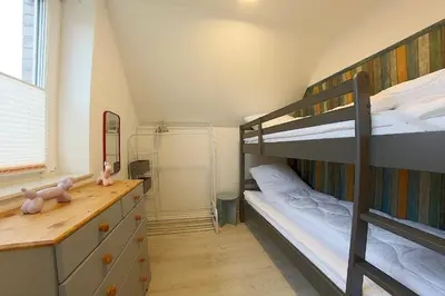 Ein Bett oder Betten in einem Zimmer der Unterkunft AE13 Engelsbrise