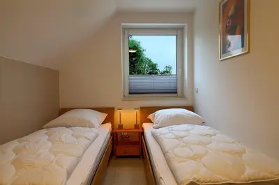 Ein Bett oder Betten in einem Zimmer der Unterkunft AE13 Engelsbrise