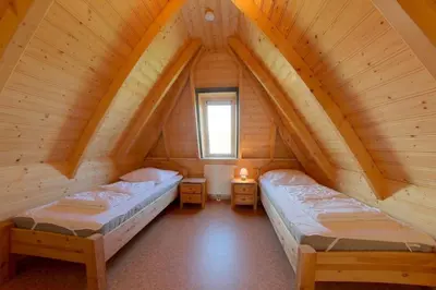 Ein Bett oder Betten in einem Zimmer der Unterkunft SV3 Mellumplate 56