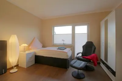 Ein Bett oder Betten in einem Zimmer der Unterkunft Gästehaus Dorum 03