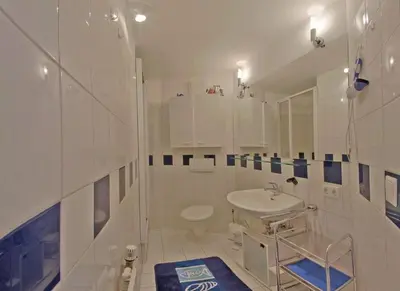 Ein Badezimmer in der Unterkunft KW42-306 Triton mit Schwimmbad