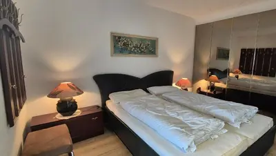 Ein Bett oder Betten in einem Zimmer der Unterkunft Terrassenhaus, FeWo 63
