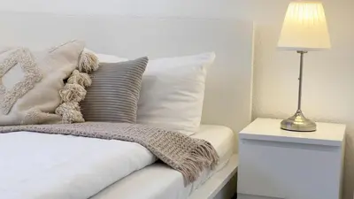 Ein Bett oder Betten in einem Zimmer der Unterkunft Kapitänshaus FeWo 7