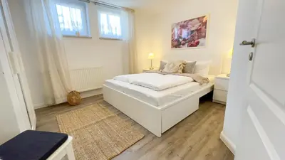 Ein Bett oder Betten in einem Zimmer der Unterkunft Kapitänshaus FeWo 7