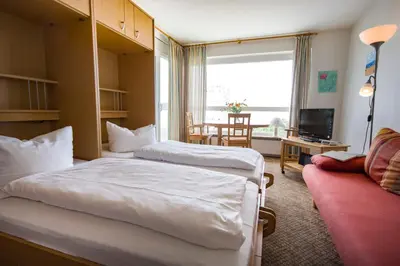 Ein Bett oder Betten in einem Zimmer der Unterkunft Frische Brise FeWo 10 08