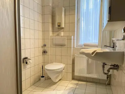 Ein Badezimmer in der Unterkunft Haus Nordseeperle FeWo 4