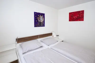 Ein Bett oder Betten in einem Zimmer der Unterkunft Duhner Dorfvilla, FeWo 1