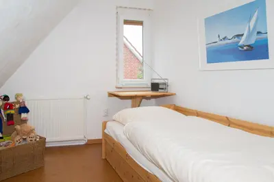 Ein Bett oder Betten in einem Zimmer der Unterkunft Ferienhaus, Kleine Perle