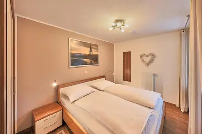 Ein Bett oder Betten in einem Zimmer der Unterkunft Residenz Hohe Lith 321