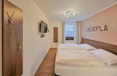 Ein Bett oder Betten in einem Zimmer der Unterkunft Residenz Hohe Lith 321