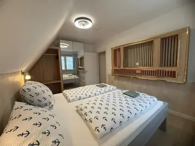 Ein Bett oder Betten in einem Zimmer der Unterkunft Kenny & Henry Familienzimmer