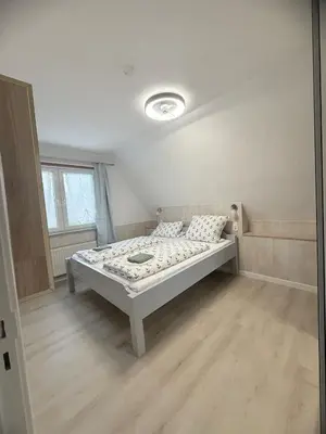 Ein Bett oder Betten in einem Zimmer der Unterkunft Kenny & Henry Familienzimmer