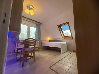 Ein Bett oder Betten in einem Zimmer der Unterkunft Kenny & Henry Familienzimmer