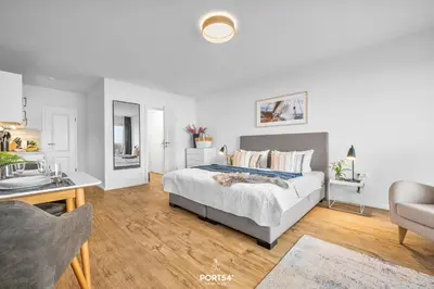 Ein Bett oder Betten in einem Zimmer der Unterkunft Ferienwohnung Seeblick 203 Büsum