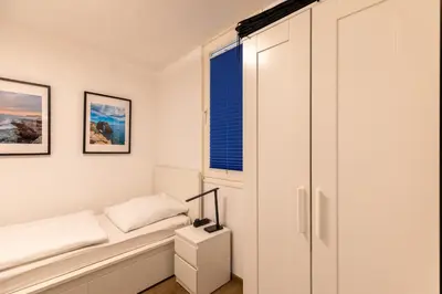 Ein Bett oder Betten in einem Zimmer der Unterkunft Haus Nordseebrandung Wohnung 12