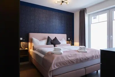 Ein Bett oder Betten in einem Zimmer der Unterkunft Kattegat Apartment 01