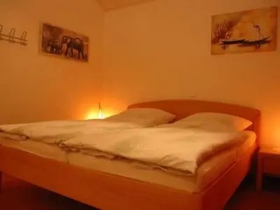 Ein Bett oder Betten in einem Zimmer der Unterkunft Holiday Home Haus Stella Maris mit Bootssteg - All Inklusive by Interhome