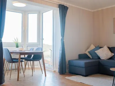 Ein Sitzbereich in der Unterkunft Apartment Dein zweites Zuhause an der Nordseeküste - Sauna by Interhome