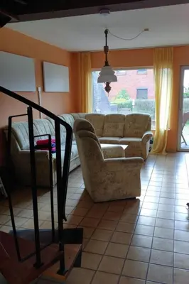 Ein Sitzbereich in der Unterkunft Holiday Home mit Garten- Grill und Terrasse by Interhome