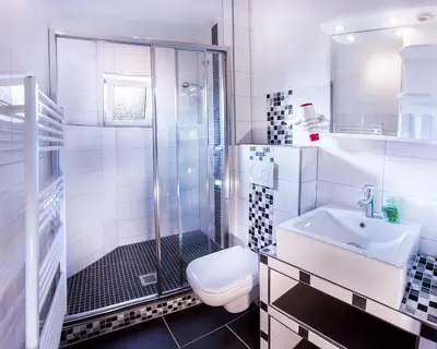 Ein Badezimmer in der Unterkunft Die große Cuxoase FeWo 1