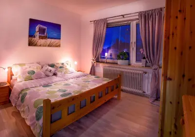 Ein Bett oder Betten in einem Zimmer der Unterkunft Die große Cuxoase FeWo 1