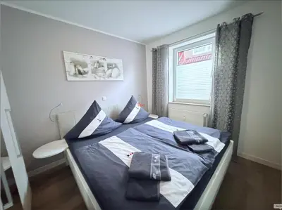 Ein Bett oder Betten in einem Zimmer der Unterkunft Hamburger Str 24 FeWo 2