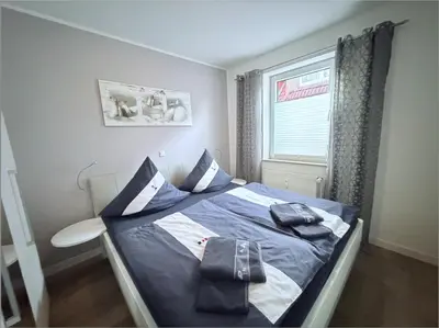 Ein Bett oder Betten in einem Zimmer der Unterkunft Hamburger Str 24 FeWo 2