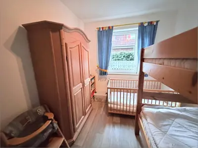 Ein Bett oder Betten in einem Zimmer der Unterkunft Hamburger Str 24 FeWo 2