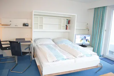 Ein Bett oder Betten in einem Zimmer der Unterkunft Hanseatic 611