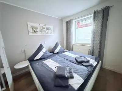 Ein Bett oder Betten in einem Zimmer der Unterkunft Hamburger Str. 24 FeWo 2