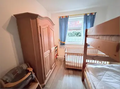 Ein Bett oder Betten in einem Zimmer der Unterkunft Hamburger Str. 24 FeWo 2