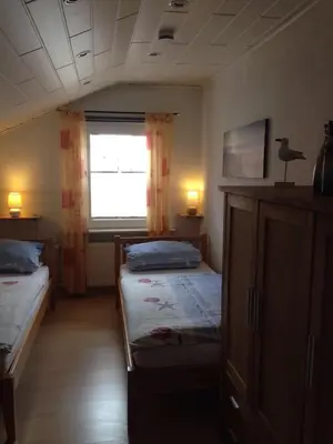 Ein Bett oder Betten in einem Zimmer der Unterkunft Wohnung Elbelotse