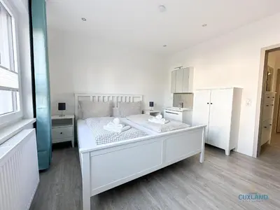 Ein Bett oder Betten in einem Zimmer der Unterkunft Ferienwohnung am Kurpark