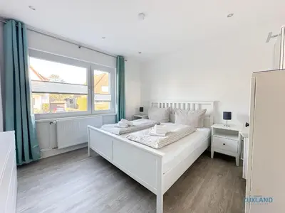 Ein Bett oder Betten in einem Zimmer der Unterkunft Ferienwohnung am Kurpark