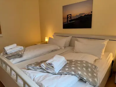 Ein Bett oder Betten in einem Zimmer der Unterkunft Strandresidenz Rosengarten, Hohenzollernstr 30, App 110
