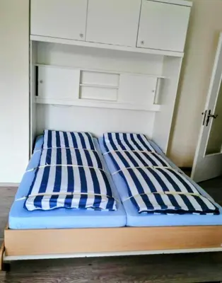 Ein Bett oder Betten in einem Zimmer der Unterkunft Ferienwohnung Nordwind Büsum