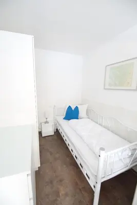 Ein Bett oder Betten in einem Zimmer der Unterkunft Kleine Muschel