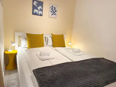 Ein Bett oder Betten in einem Zimmer der Unterkunft Poseidon FeWo 28