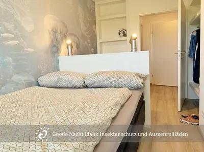 Ein Bett oder Betten in einem Zimmer der Unterkunft De Wittling Nordseeglück direkt am Deich &Hund willkommen