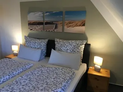 Ein Bett oder Betten in einem Zimmer der Unterkunft Gästehaus Zur Linde