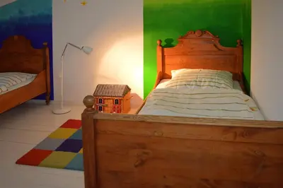 Ein Bett oder Betten in einem Zimmer der Unterkunft Himmel&Erden