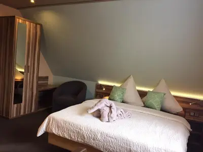 Ein Bett oder Betten in einem Zimmer der Unterkunft Hotel Meereswoge