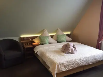 Ein Bett oder Betten in einem Zimmer der Unterkunft Hotel Meereswoge