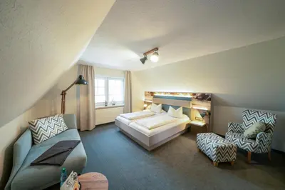 Ein Bett oder Betten in einem Zimmer der Unterkunft Deichhotel Grube
