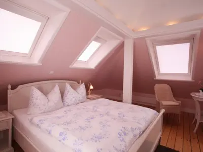 Ein Bett oder Betten in einem Zimmer der Unterkunft Hotel Villa Caldera