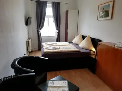 Ein Bett oder Betten in einem Zimmer der Unterkunft Hotel Hohenzollernhof